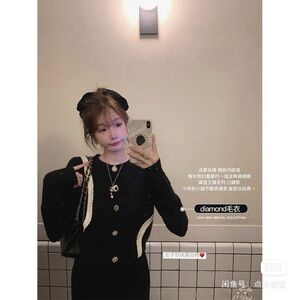 Elegant Black and Cream Women's Sweater